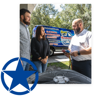 HVAC technician talking to husband and wife next to AC unit